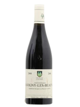 Bouteille de vin rouge Savigny-les-Beaune avec étiquette visible.