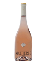 Bouteille de vin rosé Château Malherbe avec étiquette visible.